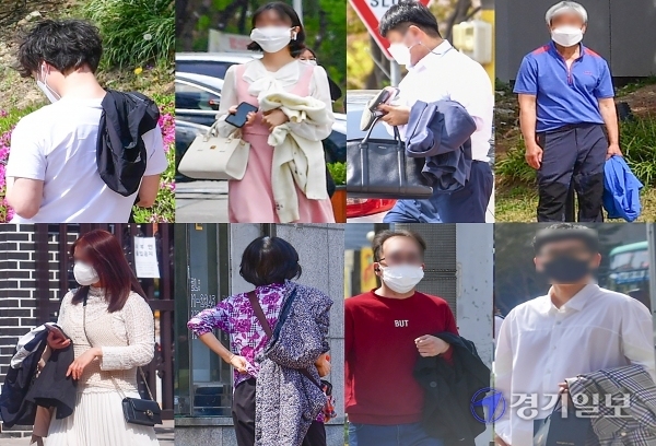 일교차가 15도를 웃도는 날씨가 연일 계속되는 가운데 9일 오후 수원시내에서 시민들이 겉옷을 손에 들고 걸어가고 있다.조주현기자