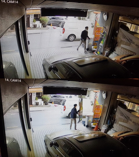 지난 4월9일 오전 7시께 정체불상의 사람들이 성남시 중원구 모란시장의 한 식당 앞에 승합차량을 세운 뒤 오비맥주 ‘한맥’ 홍보물을 무단으로 수거해 차량 뒤쪽 트렁크에 싣는 장면이 찍힌 CCTV 영상 오비맥주 제공